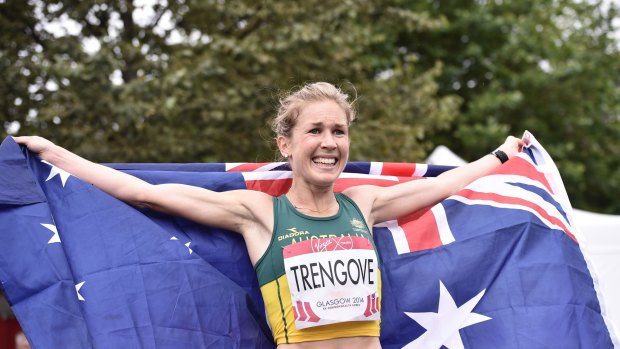 Jess Trengove celebrates with the Australian flag after taking the bronze in the women's marathon.