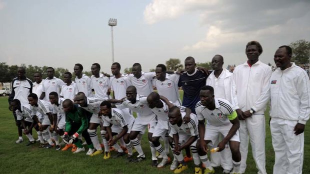 South Sudan's national soccer squad pose for a photograph prior to their first international football game.