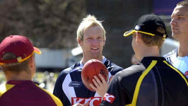 Victorian captain Cameron White chats with (from left) Queensland's James Hopes, Western Australia's Adam Voges and New South Wales's Stuart Clark.