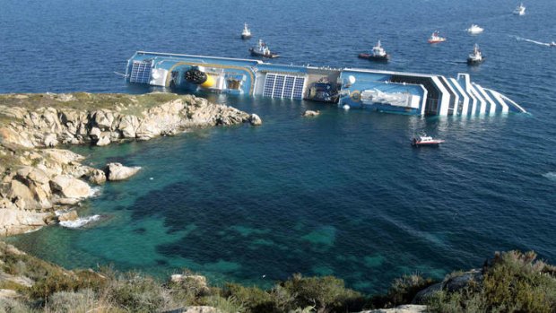 The Costa Concordia leans on its side after running aground in the tiny Tuscan island of Giglio, Italy. Italian authorities are hoping to right the ship soon.