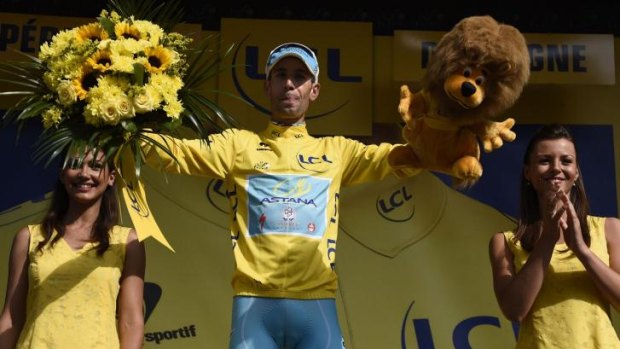 Italy's Vincenzo Nibali celebrates his overall leader yellow jersey on the podium at the end of the 20th stage, a 54km individual time trial, as part of the Tour de France.