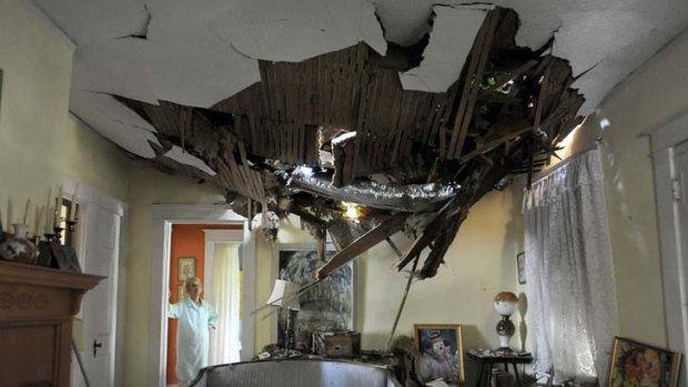 An oak tree fell onto this house in Lynchburg, Virginia, during the storms.