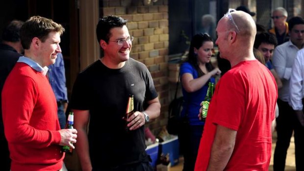 Zed Seselja chats with one of his campaign volunteers - right - Rich Armitage and MLA Alistair Coe at a post BBQ at Zed's parents place.