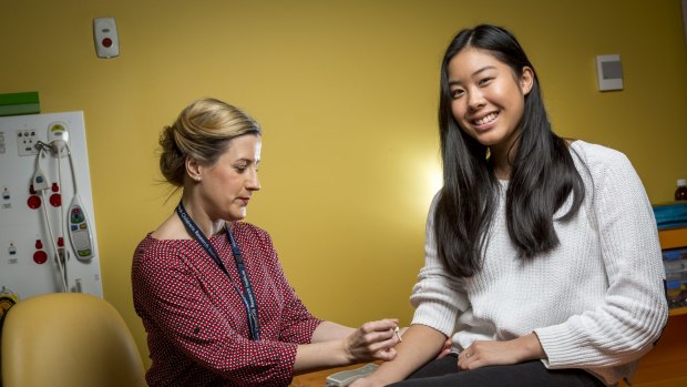 Caitlin Louey, 16, who has suffered from anaphylaxis to pecan nuts, undergoes allergy testing from research nurse Holly Shaw as a part of SchoolNuts, a Murdoch Children's Research Institute study. 