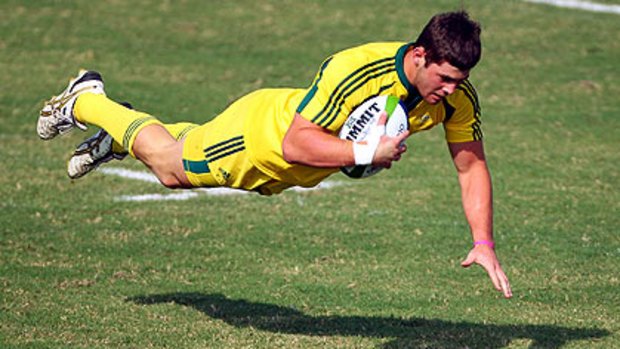 Liam Gill scores for Australia in the rugby sevens final at last year's Commonwealth Games.