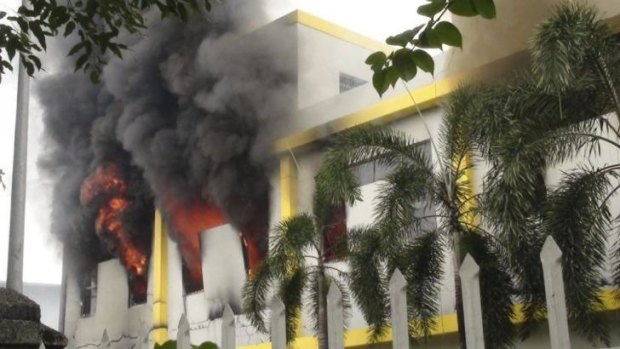 Smoke rises from the Maxim company building in Binh Duong province on Wednesday.