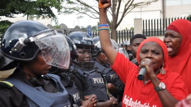 Police women in riot gear block the route during a demonstration calling on the government to rescue the kidnapped girls of the government secondary school in Chibok, in Abuja, Nigeria.