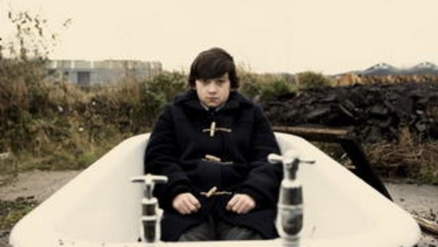 One boy in a tub: Oliver Tate (Craig Roberts) tries working his way through the woes of teenhood in the quirky British comedy <i>Submarine</i>.