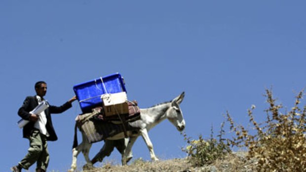 Poll preparations ... a donkey carries ballot boxes to the remote village of Hisarak in the Panjshir province north of Kabul.