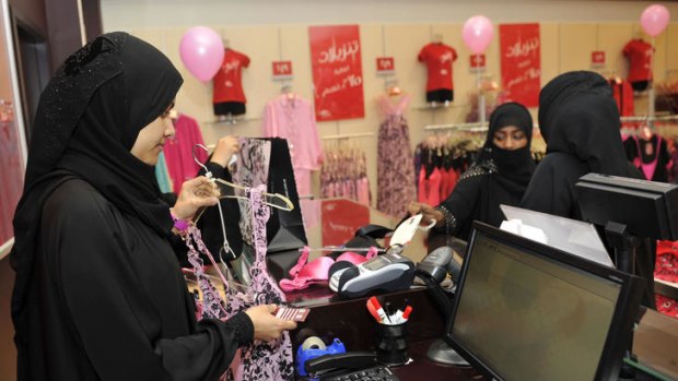 Fully-veiled Saudi women shop at a lingerie store in the Saudi Red Sea port of Jeddah.