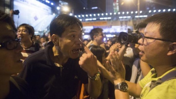Demonstrators argue with each other outside the central government offices in Hong Kong.