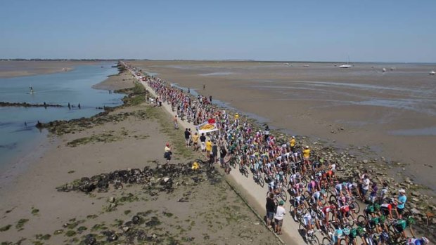 Calm before the storm ... the peloton crosses the Passage de Gois - a tide-flooding causeway connecting the tiny Bay of Biscay island of Noirmoutier to the French mainland - on the first stage of the Tour de France.