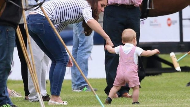 The Duchess of Cambridge gives Prince George a helping hand.
