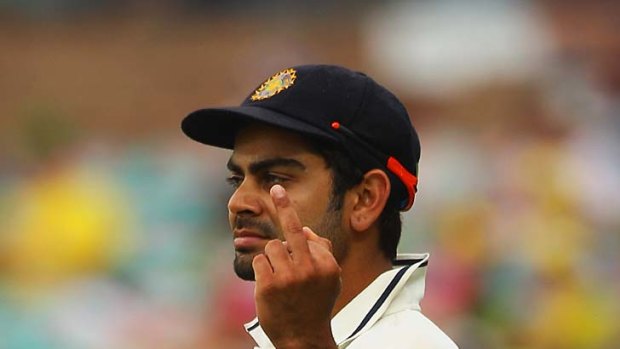 Fine gesture: The one-finger salute cost Virat Kohli half his match fee.