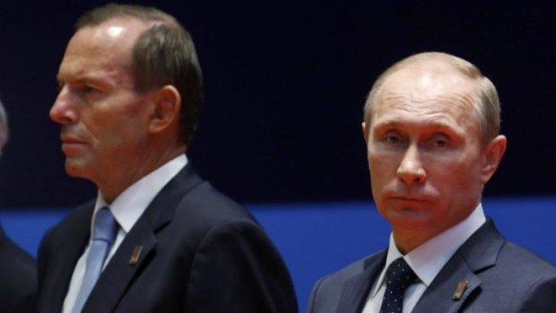 Differing views: Tony Abbott and Vladimir Putin at an APEC meeting in 2013.
