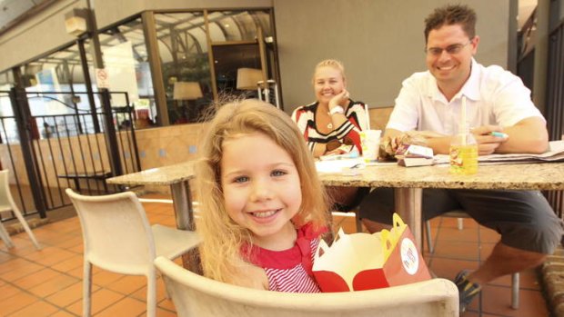 Not sure about quality: Yervette and Stephen Spratt with daughter Jessica at North Parramatta McDonald's.