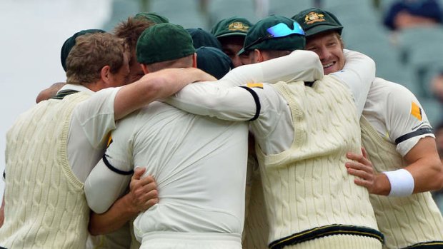 Bond: the Australian team celebrate as one after sealing victory in the second Test.