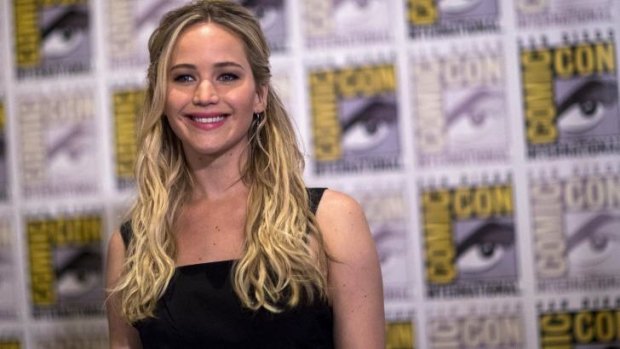 Jennifer Lawrence poses in the press line for <i>The Hunger Games</i> at Comic Con.