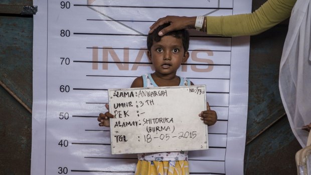 Three-year-old Anwarsah, a Rohingya child, poses for an identification photo at a temporary shelter in Aceh province, Indonesia, in May 2015.