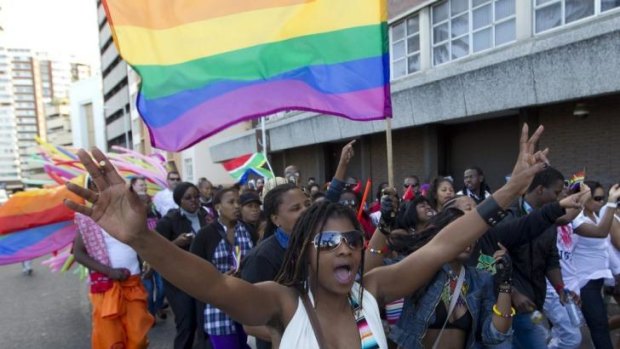 A woman holds her hands up during the Durban Pride parade where several hundred people marched through the Durban city centre back in 2011 in support of gay rights.