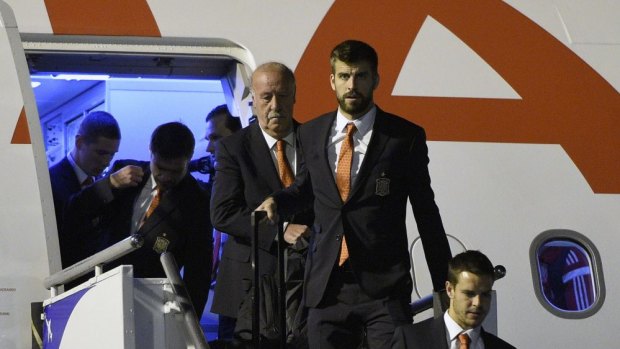 Spain's coach Vicente Del Bosque (centre, left) and defender Gerard Pique (centre, right) arrive at Alfonso Pena International Airport in Curitiba ahead of the World Cup.