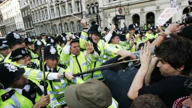 Police and anti-Bush protesters clash as the President met his British counterpart nearby.