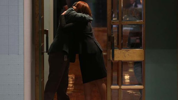 Julia Gillard is hugged by an attendant as she leaves the House of Representatives on Thursday 27 June.