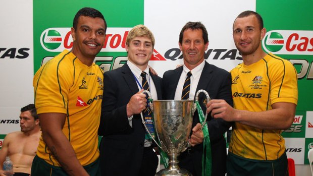 Best mates &#8230; Kurtley Beale, the suspended James O'Connor, coach Robbie Deans and Quade Cooper pose with the Tri Nations trophy.