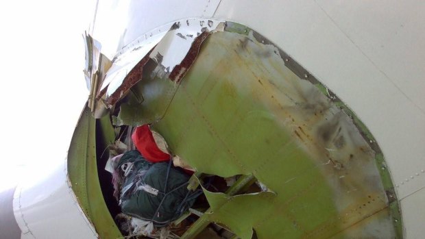 New photograph showing the hole blown in a Qantas Jumbo Jet, possibly in an earlier incident.