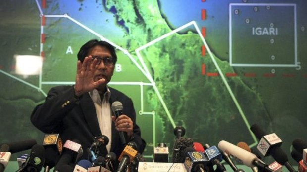 Under pressure ... Malaysia's Department of Civil Aviation's Director General Azharuddin Abdul Rahman briefs reporters on search and recovery efforts within existing and new areas for the missing Malaysia Airlines plane during a press conference in Sepang, Malaysia.