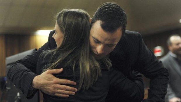 Oscar Pistorius is greeted by his sister Aimee Pistorius in court in Pretoria on July 2. The re-enactment footage of the night Pistorius shot his girlfriend Reeva Steenkamp uses his sister in Steenkamp's place.   