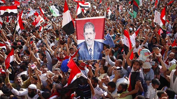 Supporters of Egypt's new president, Mohamed Mursi, celebrate his victory in Tahrir Square.