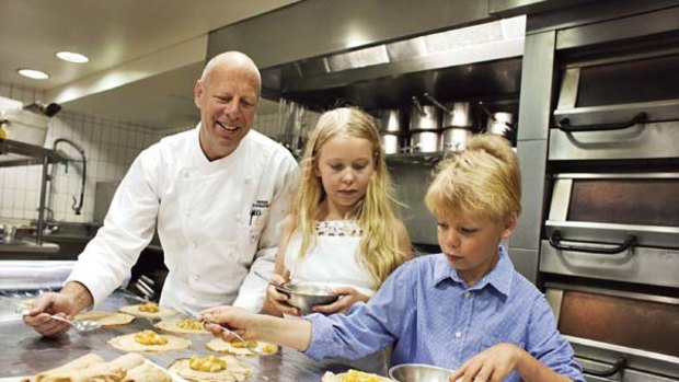 In the blood ... the Bathers Pavilion chef Serge Dansereau accepts a helping hand from  his children Celeste, 11, and Sasha, 10, in the restaurant kitchen.