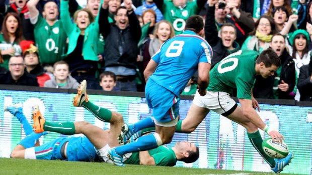 Jonathan Sexton scores a try out wide for Ireland.