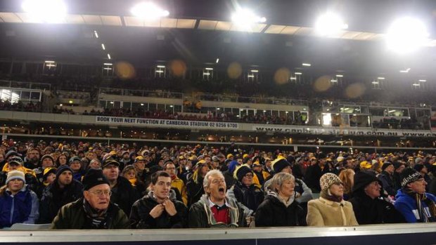 Supporters watch the Brumbies take on the British and Irish Lions at Canberra Stadium.