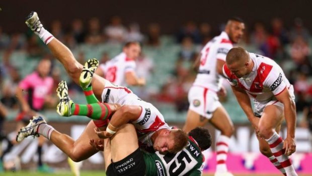 Dragons forward Jack De Belin, who could be in trouble with the NRL judiciary when charges are announced on Monday, dumps South Sydney back-rower Kyle Turner into the SCG turf on Saturday night.
