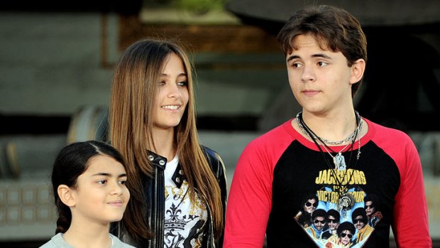 Public eye ... From left, Blanket, Paris and Prince Michael Jackson attend a tribute event for their father in Los Angeles in January.