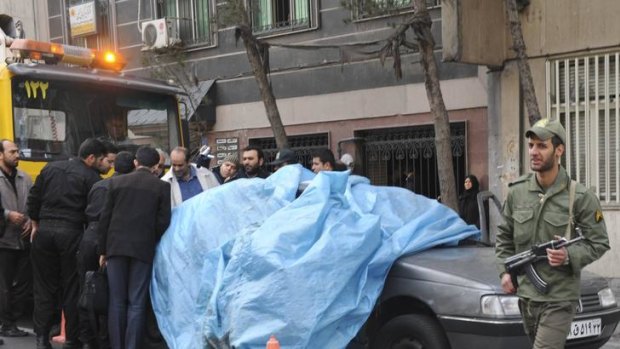 The scene of the bomb blast in Tehran that killed Iranian nuclear scientist Mostafa Roshan.