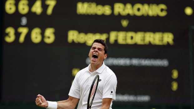 Canadian Milos Raonic celebrates beating Roger Federer at Wimbledon on Friday.