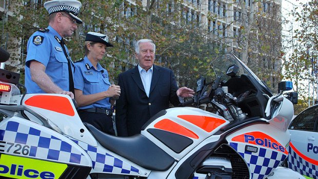 Assistant Commissioner Gary Budge and Commander of State Traffic Operations Michelle Fyfe with Road Safety Minister Rob Johnson.