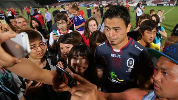 Bit hit:   Ayumu Goromaru of the Reds poses with fans and signs autographs after the Super Rugby Pre-Season match between the Reds and the Brumbies  in Brisbane.
