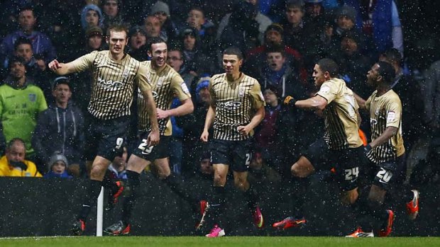 Bradford City's James Hanson (left) celebrates with teammates after scoring during the English League Cup semi-final second leg against Aston Villa last month.