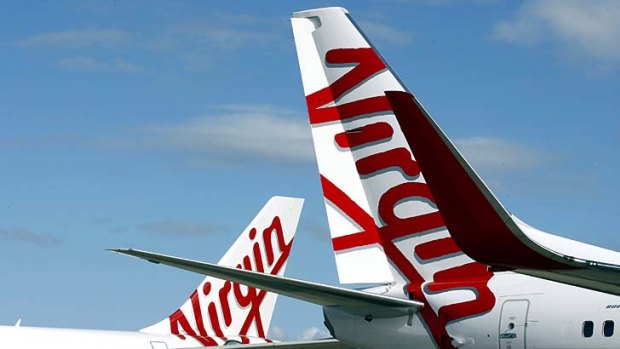 Qantas is demanding a review of Virgin Australia's shake-up of its ownership structure.