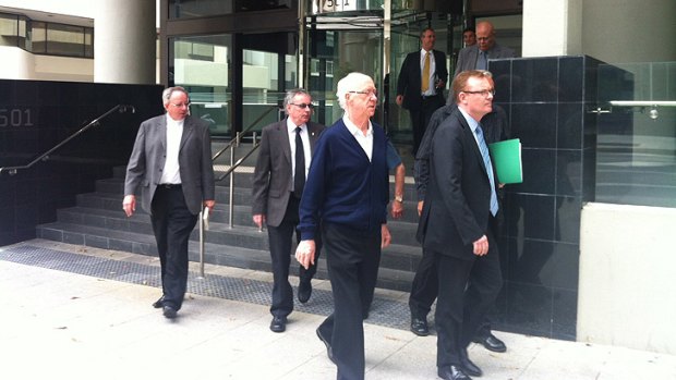 Father Thomas Henry Byrne leaving Perth court with his lawyer.