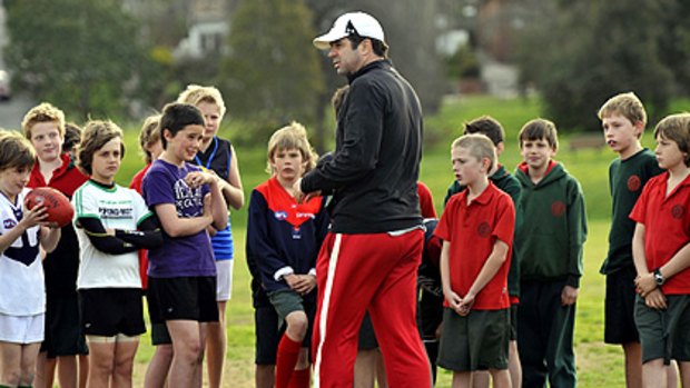 Garry Lyon enjoys teaching football to junior players, but says the rigours of coaching in the AFL do not appeal, even at his beloved Melbourne Football Club.