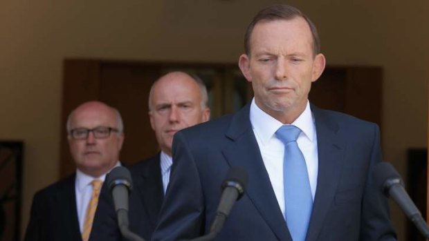 Prime Minister Tony Abbott with Senator George Brandis and Senator Eric Abetz during a press conference to announce a royal commission into unions.