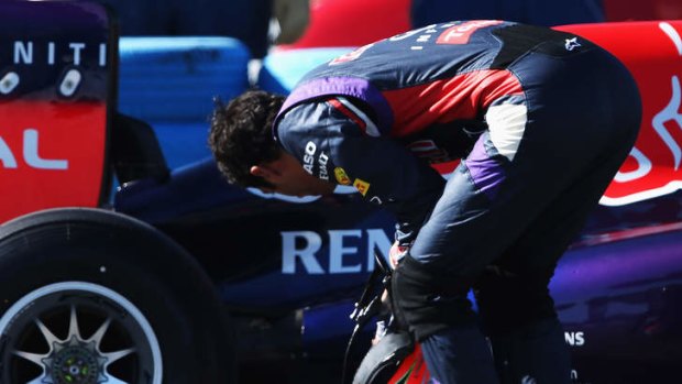 Technical difficulties: Australia's Daniel Ricciardo inspects his car during Red Bull's winter testing.