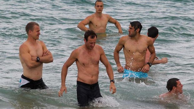 Sydney players at a recovery session at Coogee Beach following their win over St Kilda.