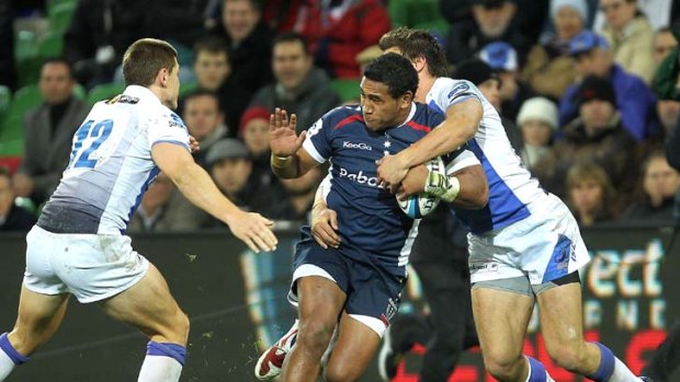 Cooper Vuna tries to bust his way through.