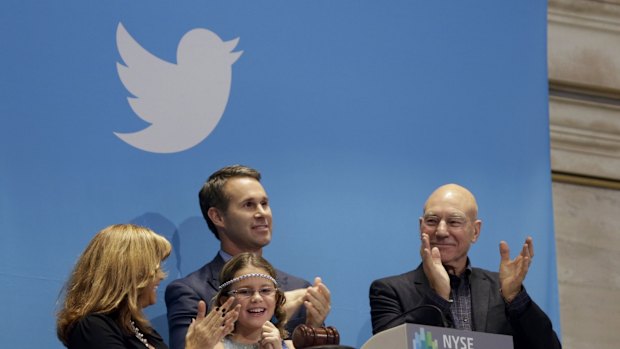 Actor Patrick Stewart (right) and nine-year-old Vivenne Harr ring the opening bell as NYSE executive vice-president Scott Cutler and Boston police officer Cheryl Fiandaca look on.